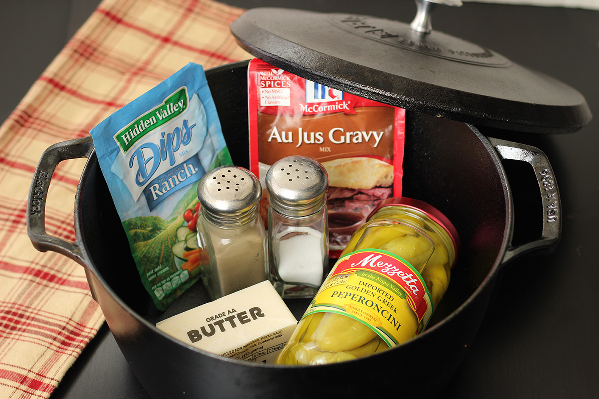 Ingredients to make Dutch oven Mississippi pot roast in a pot.