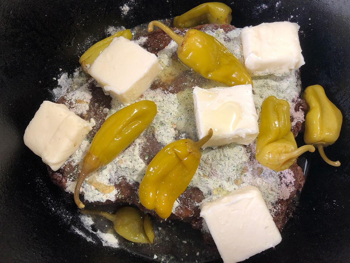 Butter and pepperoncinis added to the pot.