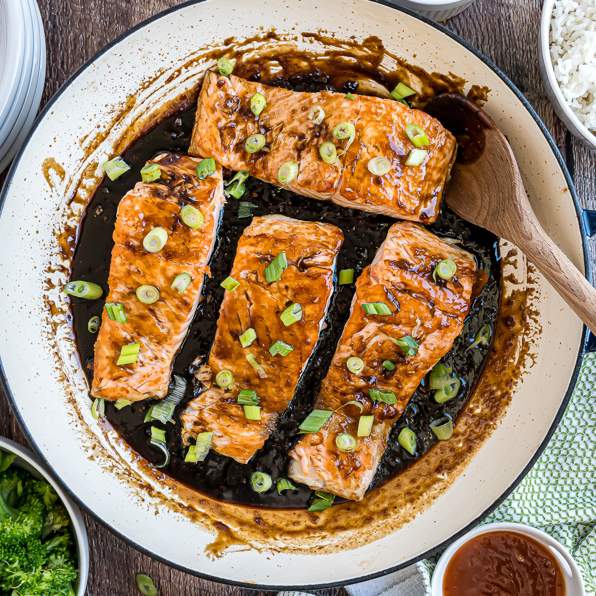 Pan seared salmon in a pan with Thai chili and balsamic sauce.