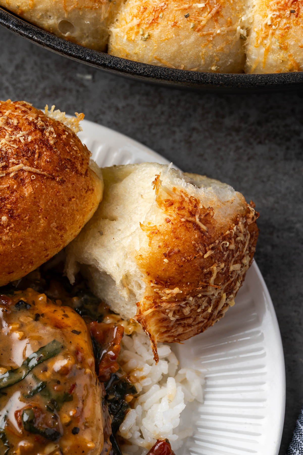 A plate with dutch oven rosemary garlic bread on it.