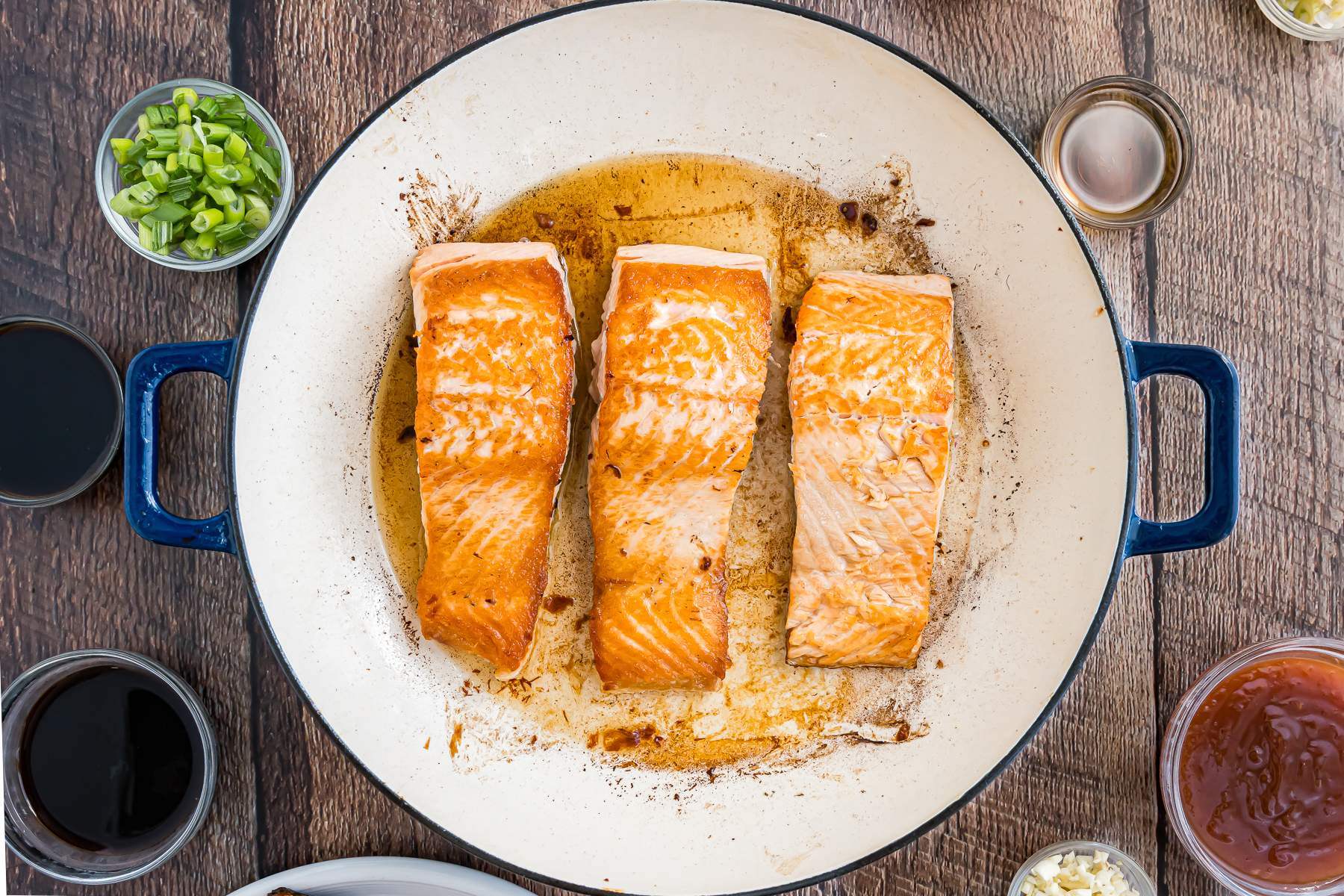 Salmon searing in the pan.