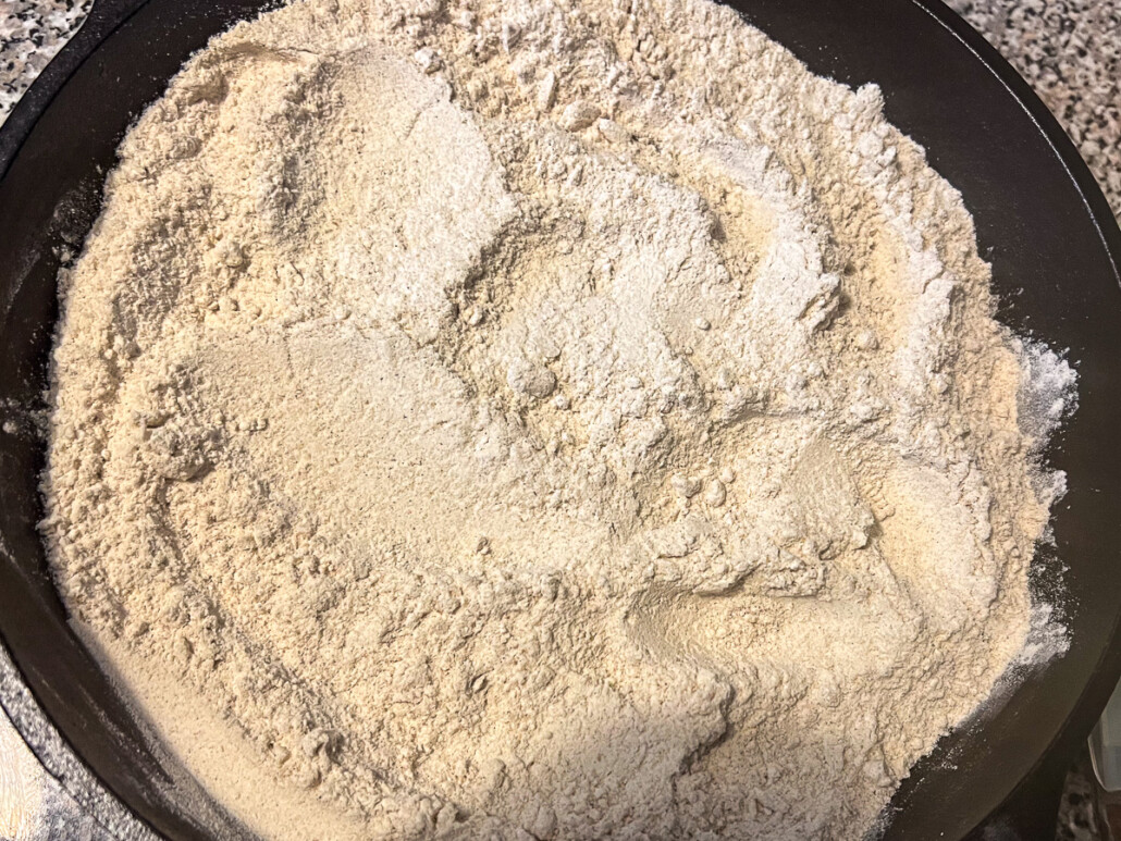 Spice cake mix evenly sprinkled over the pie filling.