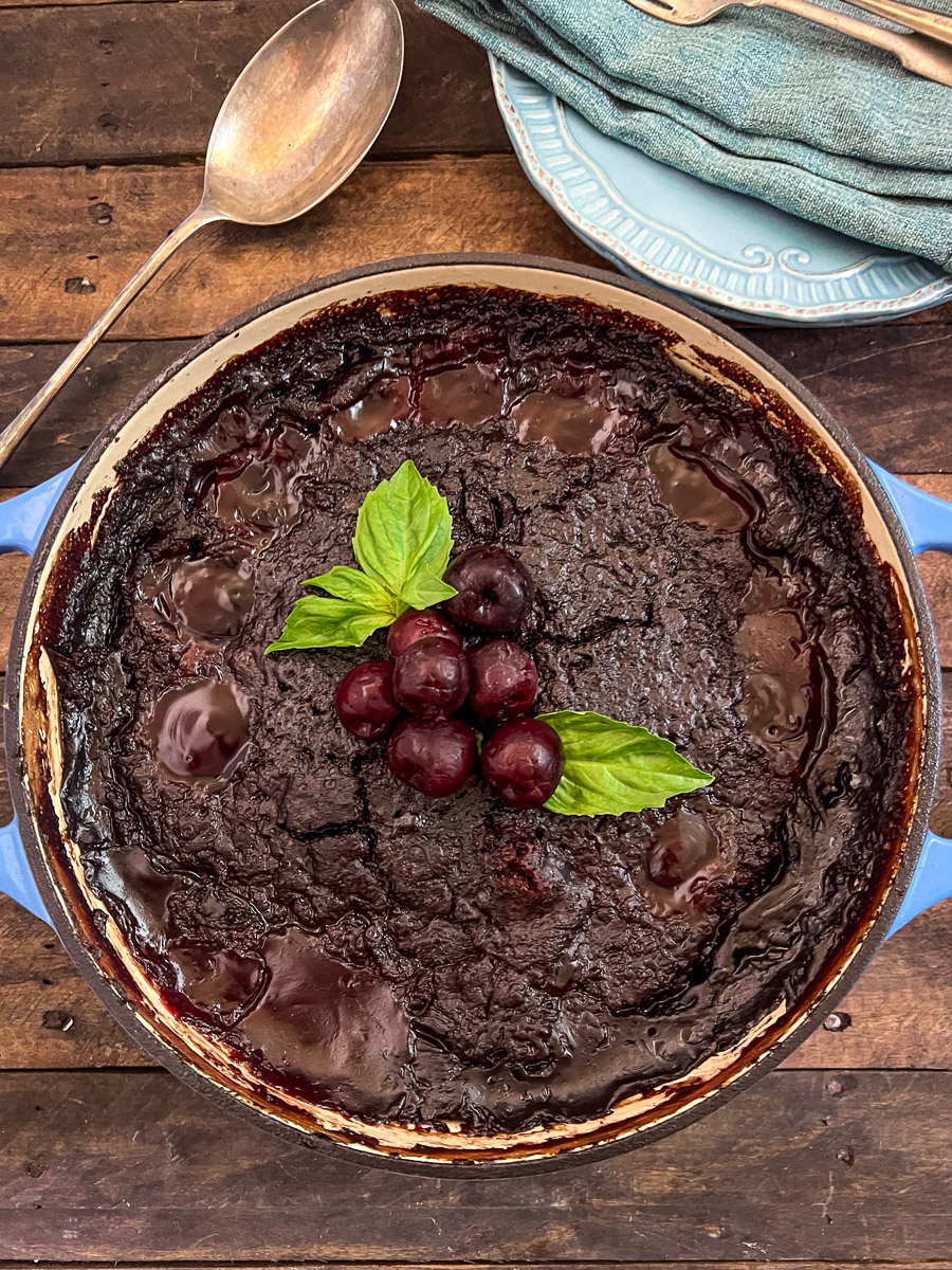 Fresh from the oven, the Cola Chocolate Cherry dump cake has bubbling fruit on the surface and a softly crusted cake topping.