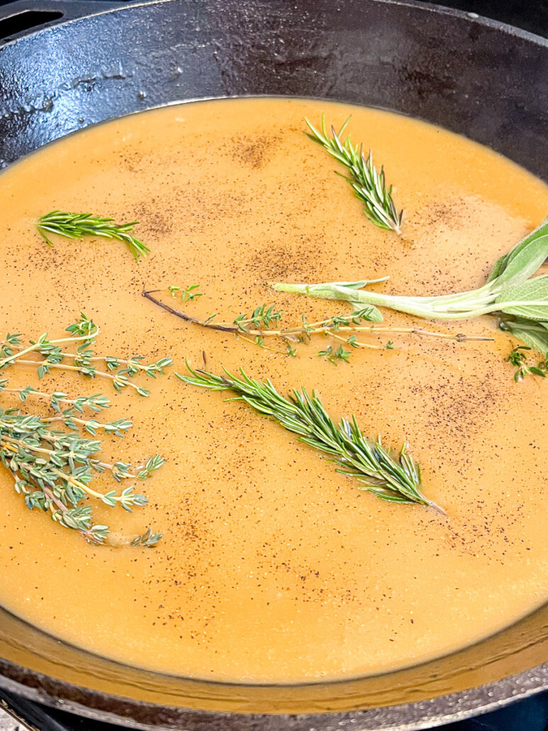 Fresh herbs, salt, and pepper added to the gravy.