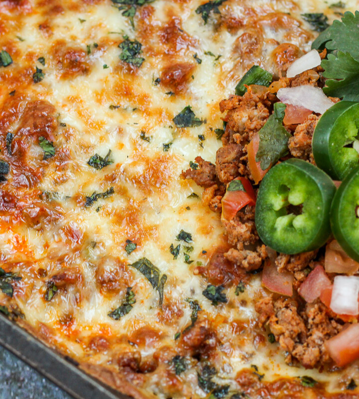 Close up of cooked and garnished dip.
