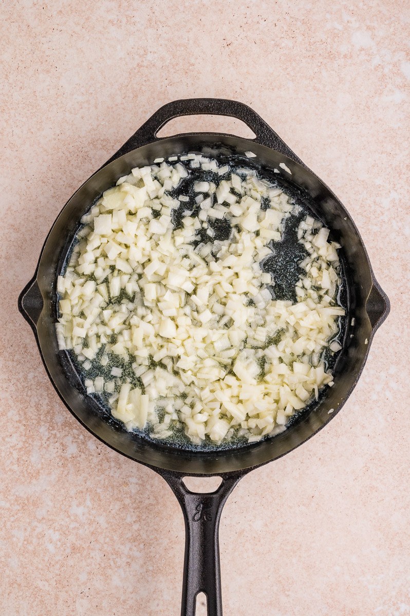 Onions cooking in a skillet.