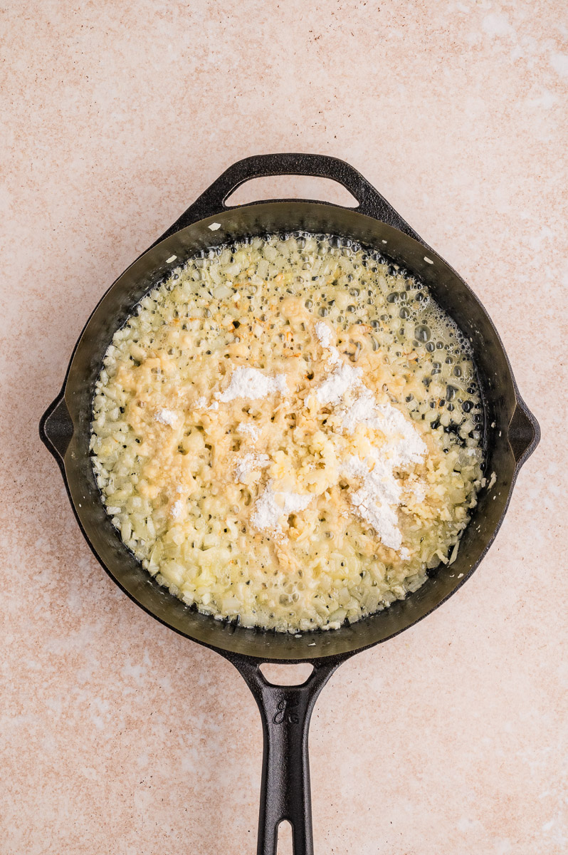 Flour and garlic added to the onions.