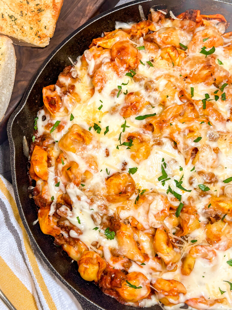  image of Tortellini with Sausage in a cast iron skillet.