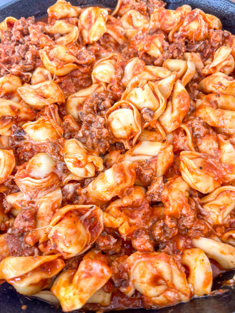 The cheeses have been full mixed in to the pasta and melted.