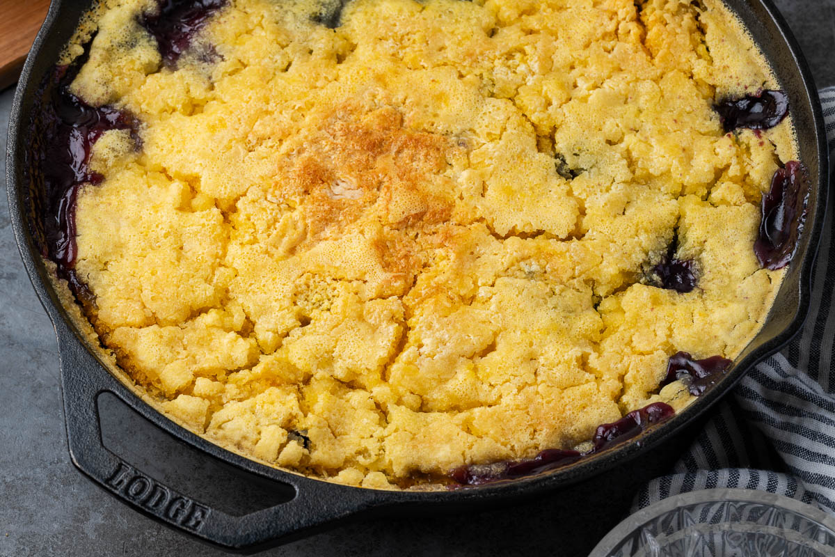 Blueberry lemon dump cake cooked in a skillet.