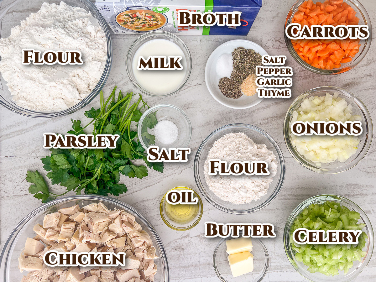 Ingredients to make Dutch oven chicken and dumplings in bowls on the table.