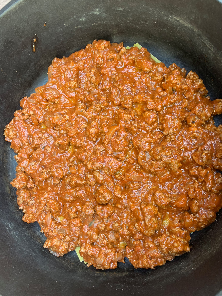 Meat added on top of the noodles.