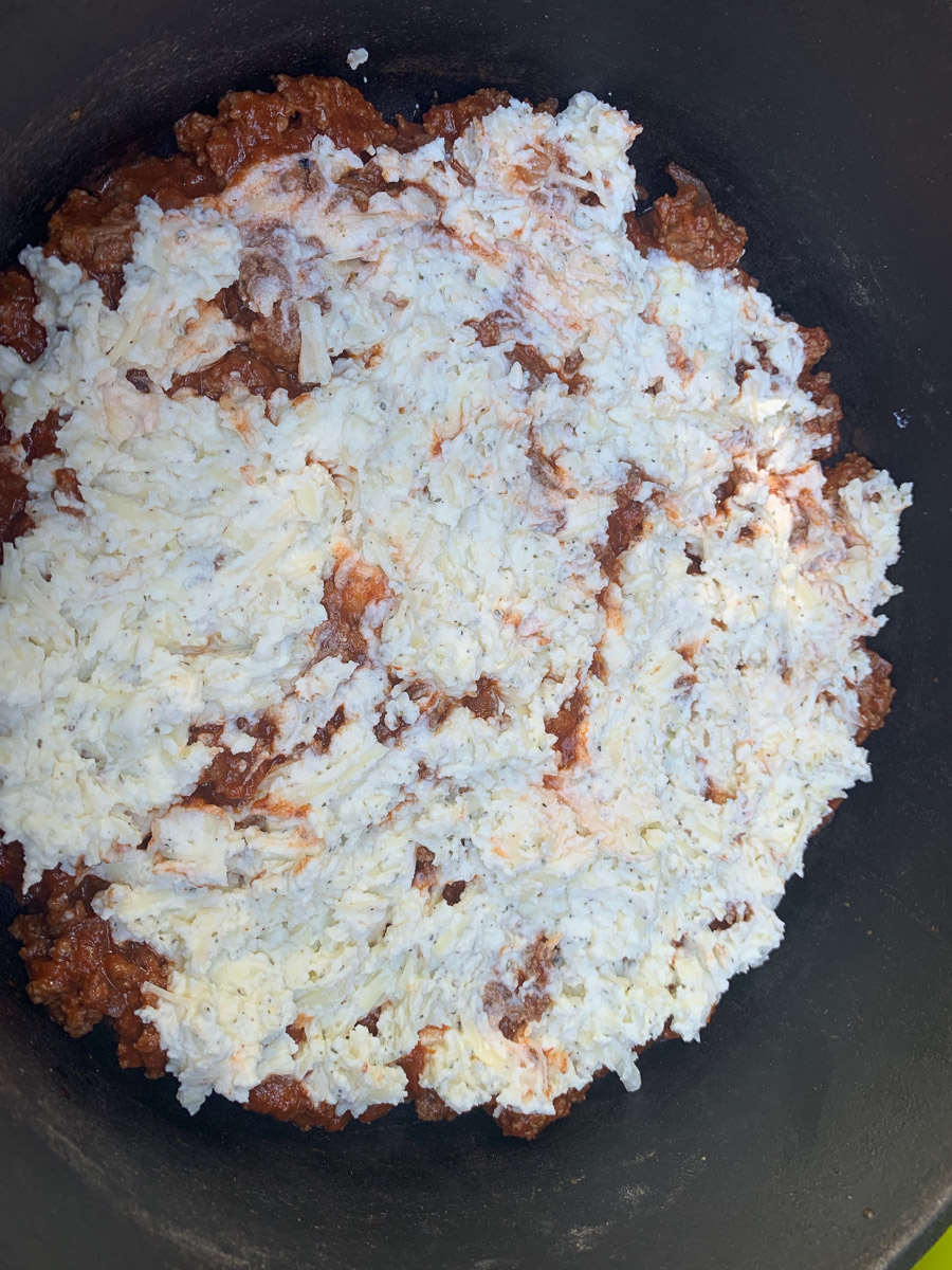 Cheese spread over the top into a smooth layer.