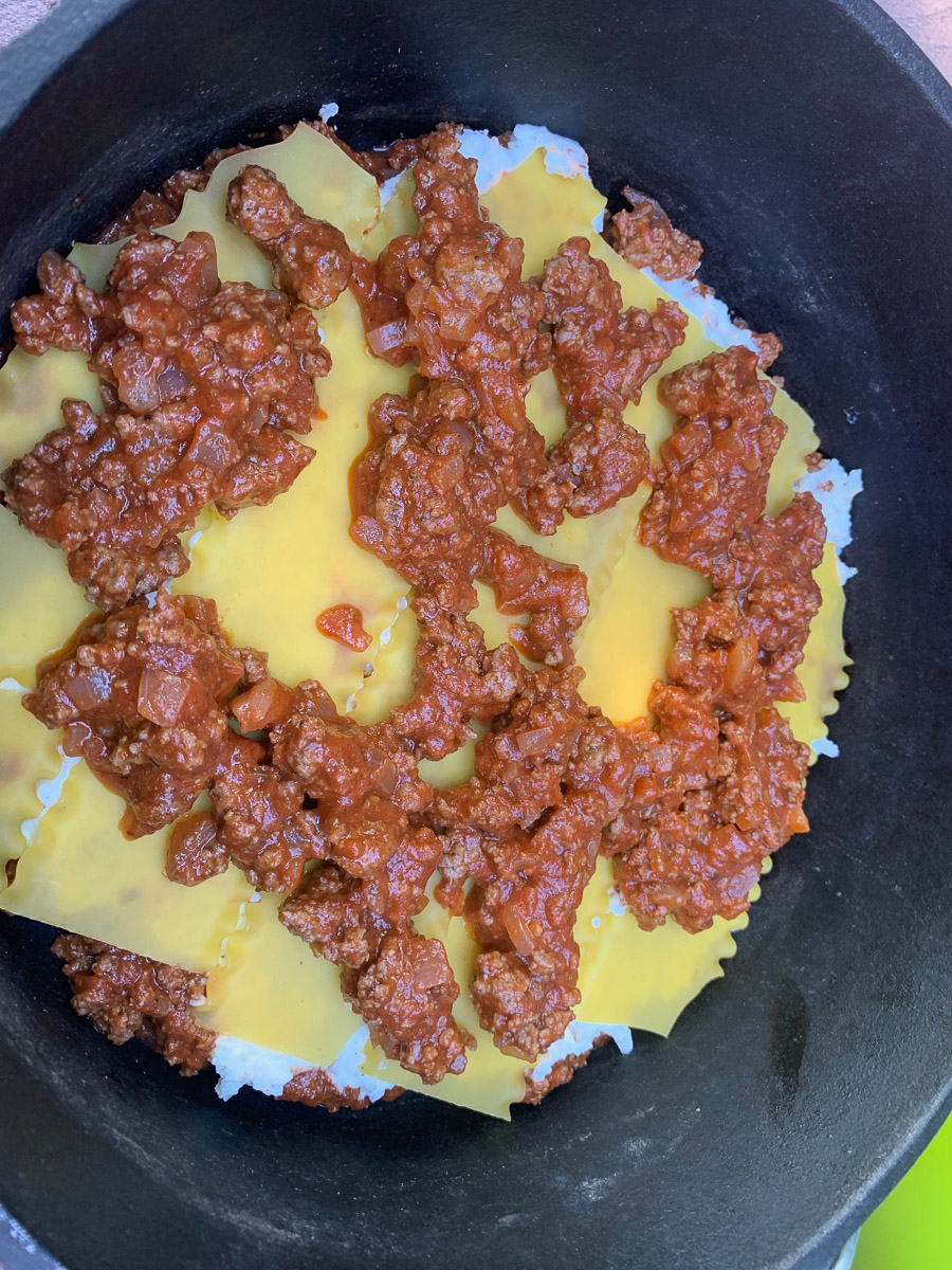 Another layer of noodles and meat added.