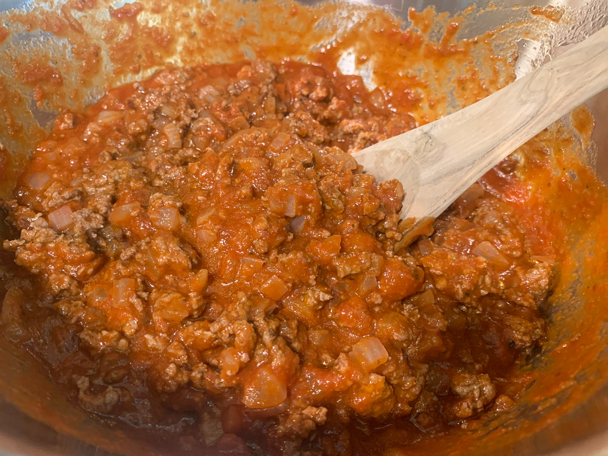 Meat mixture after tomato sauce is added.