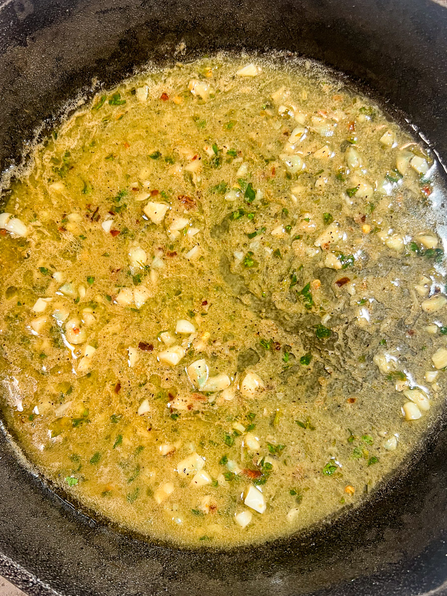Lemon butter sauce being made in the skillet.