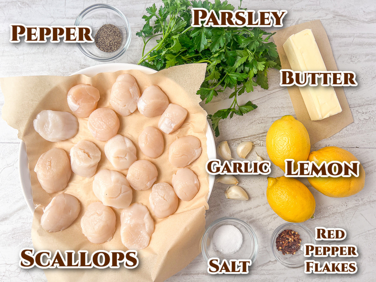 Ingredients for the recipe: pepper, parsley, butter, garlic, lemon, red pepper flakes, salt, and sea scallops.