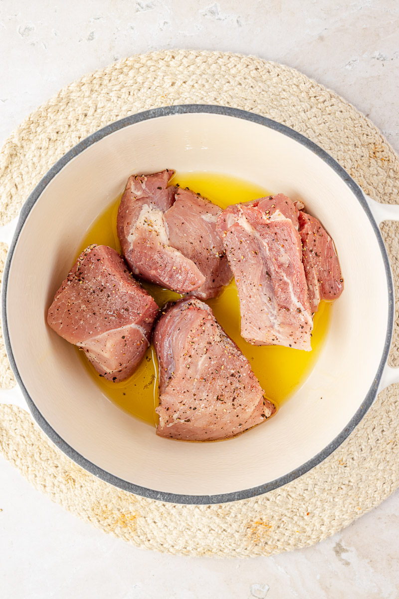 Pork searing in a dutch oven.