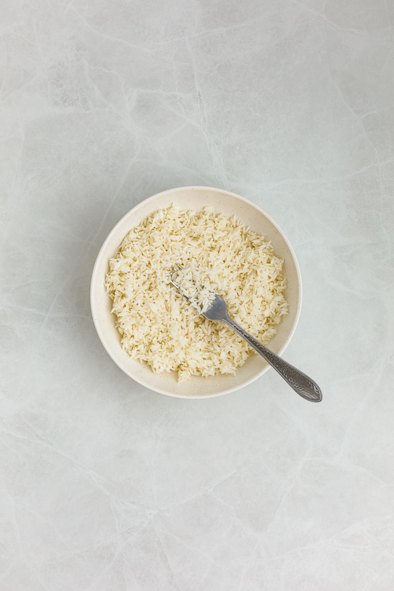 Rice broken up with a fork.