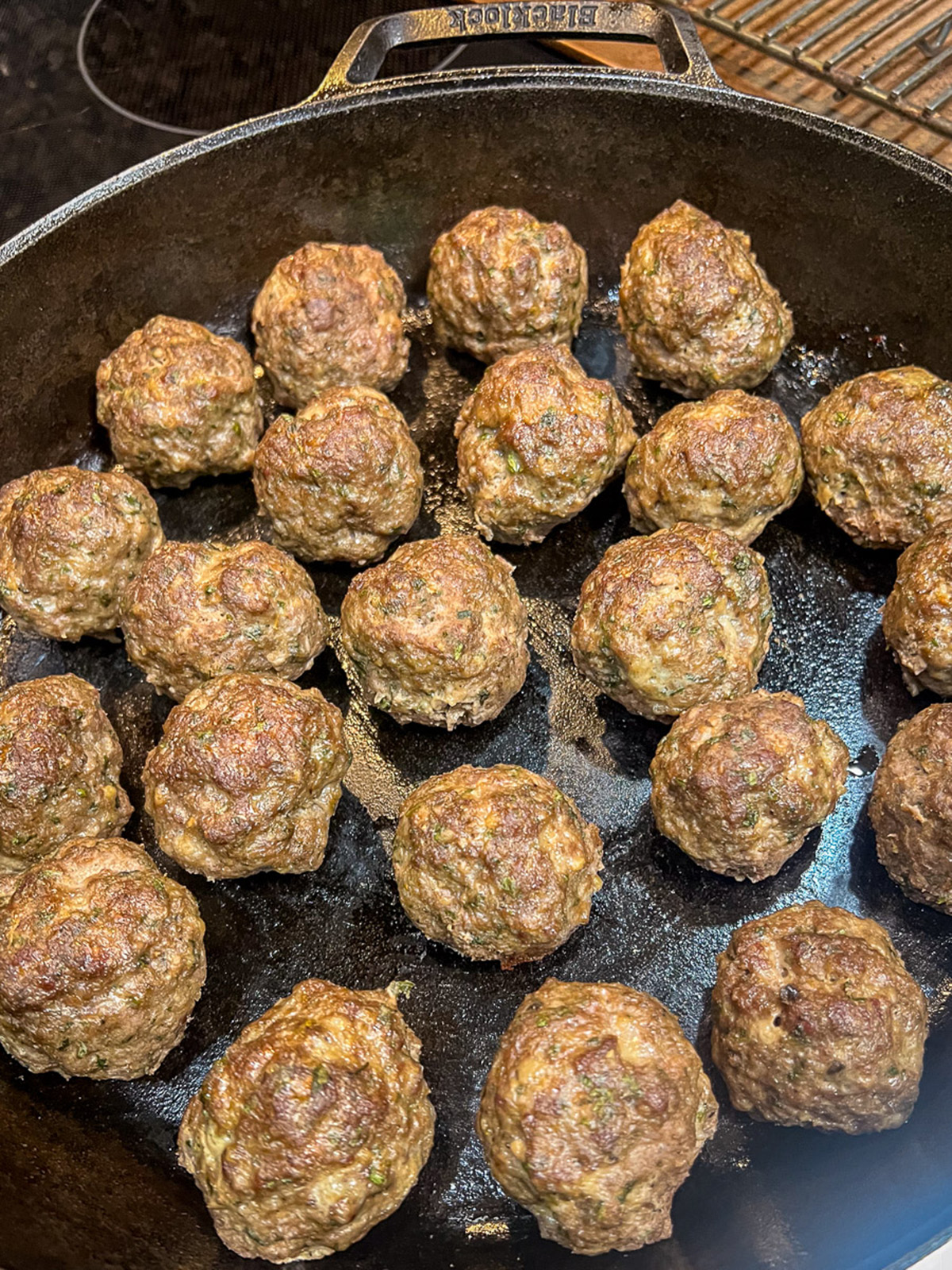 Freshly baked skillet meatballs still in the pan. 