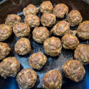 Cast iron meatballs in the skillet after cooking.