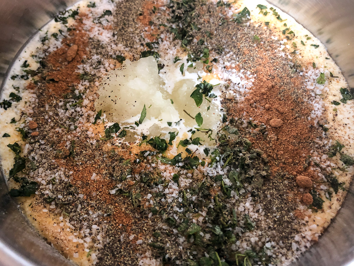 Ingredients to make cream sauce in a sauce pan.