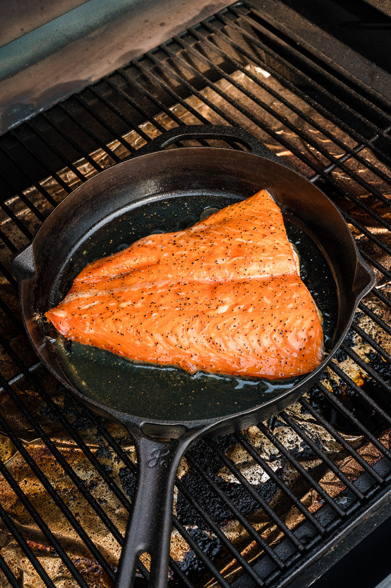 The salmon placed in a smoker.