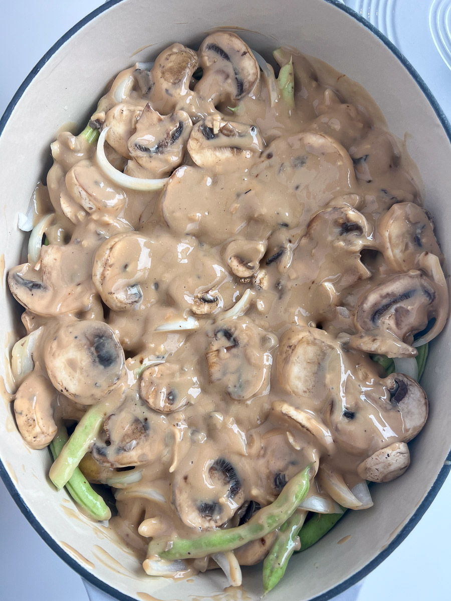 Whiskey sauce spread over the meat and vegetables in the dutch oven.