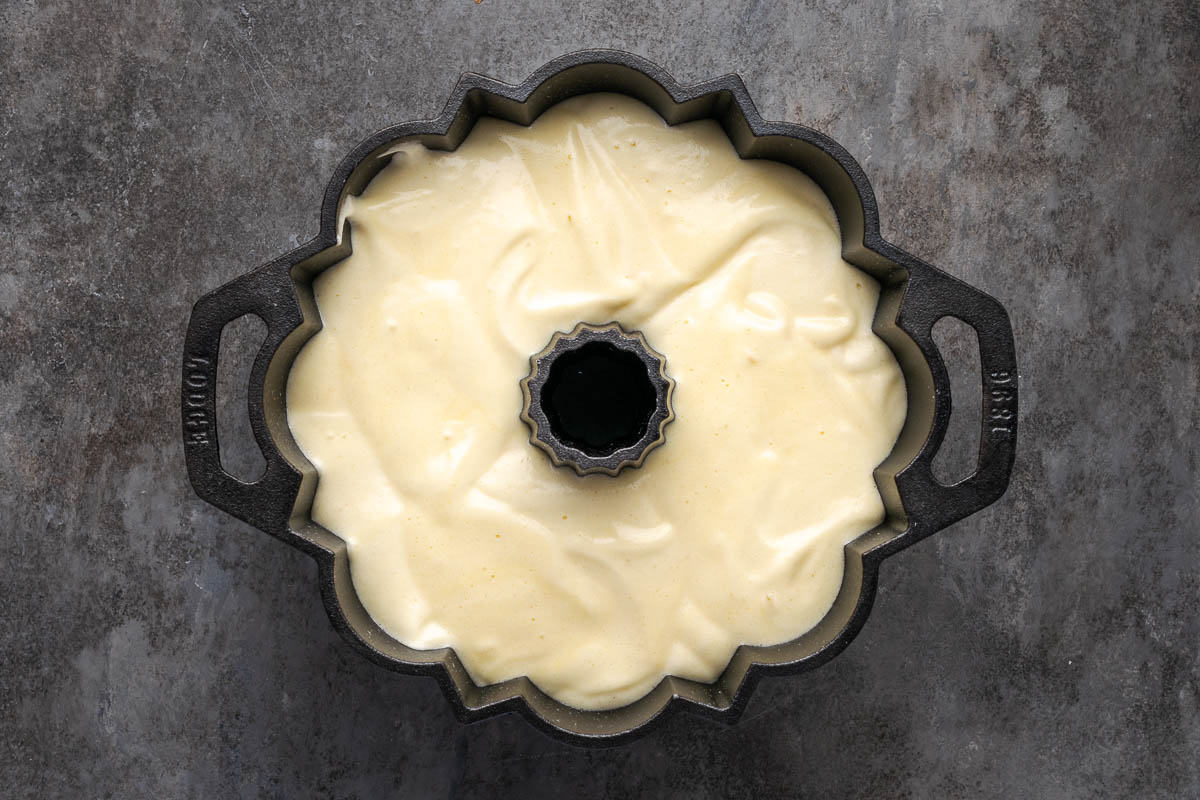 Angel food cake batter poured into a bundt pan.