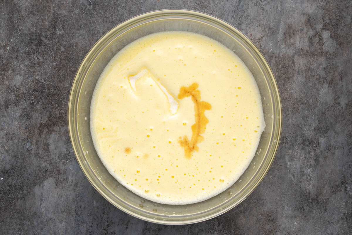 Egg yolk, water, sugar,salt and vanilla in a bowl.