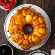 Monkey bread with butterscotch pudding on a plate.