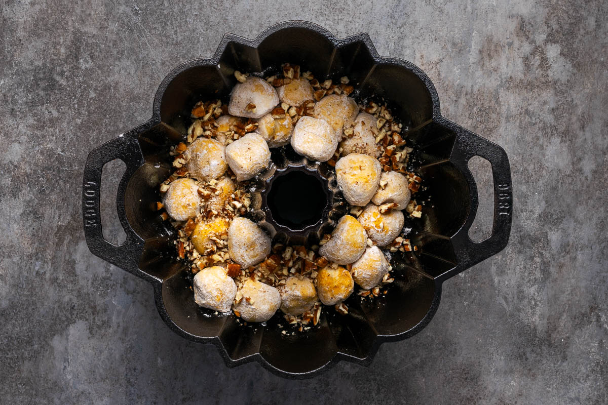 Rolls and pecans alternated in a bundt pan.