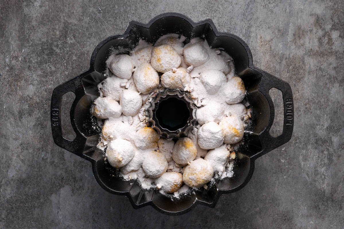 Nuts and remaining pudding mix spread over the top of the dough pieces.