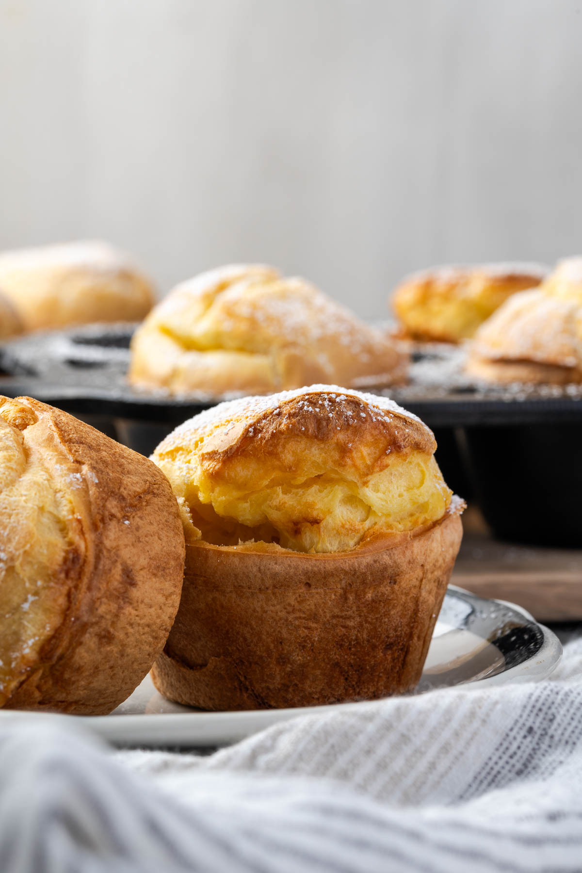 A couple of popovers on a plate.