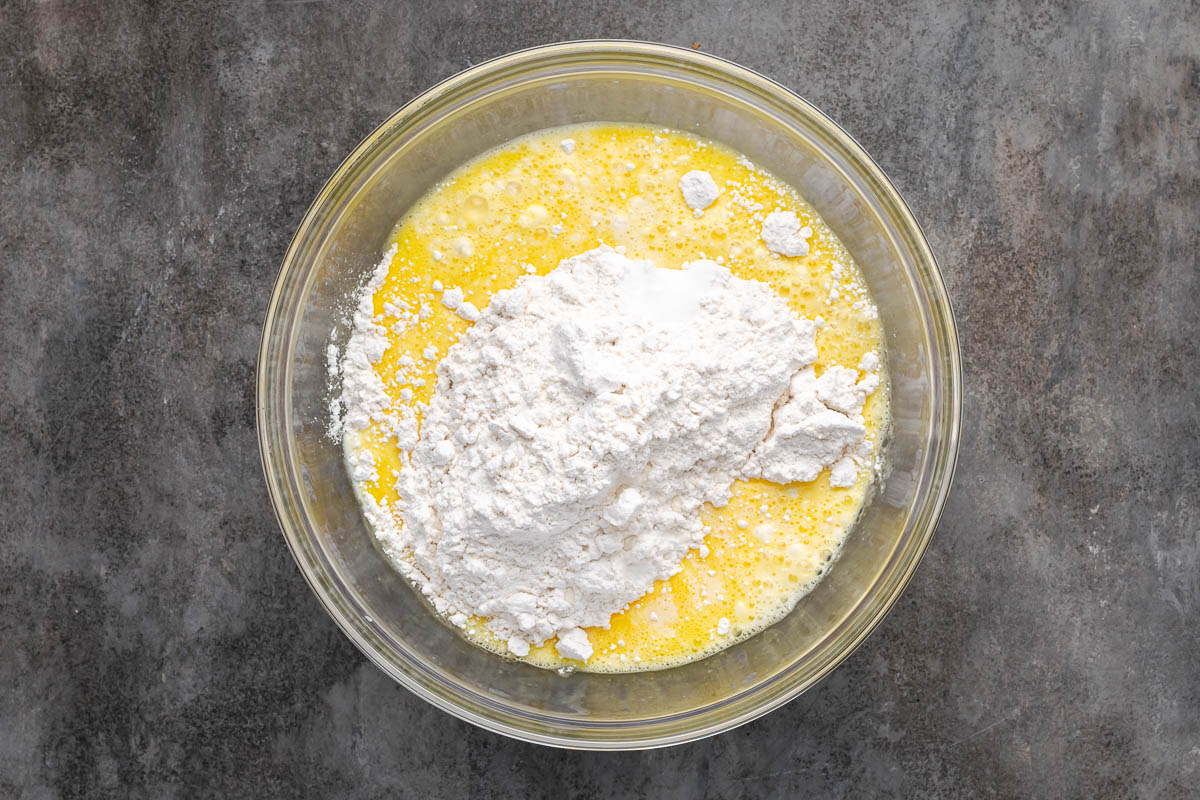 Flour, milk, salt, and confectioners’ sugar added to the egg mixture.