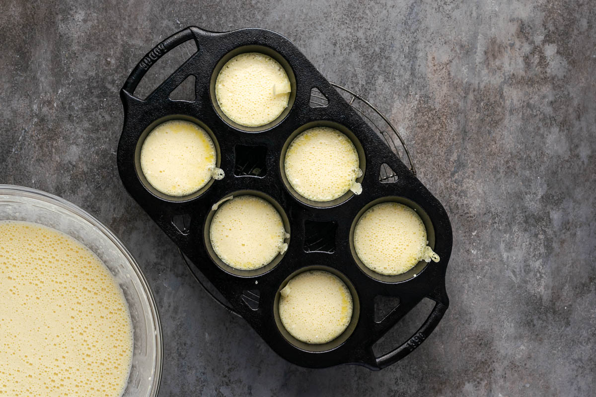 The batter poured into a popover pan.