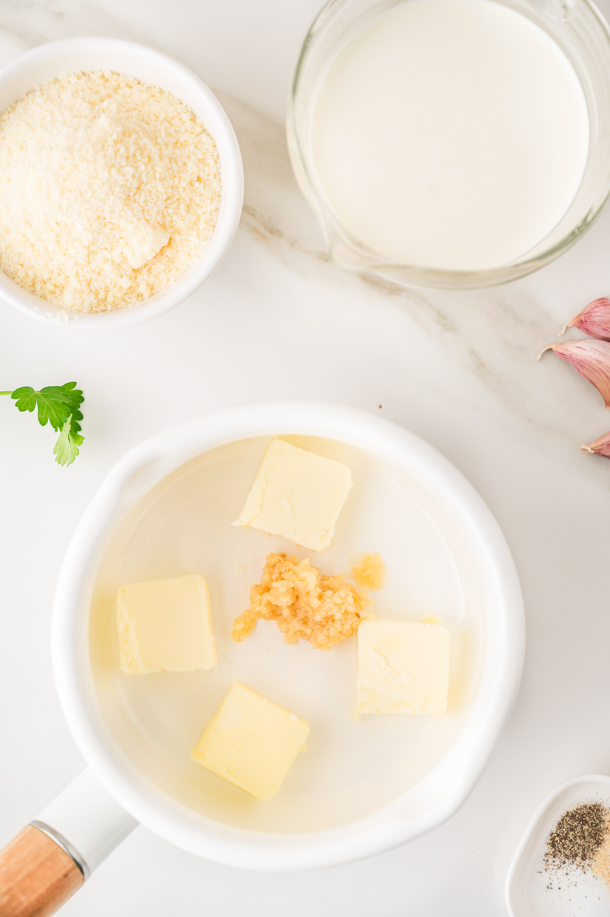 Butter and garlic cooking in a saucepan for homemade alfredo sauce