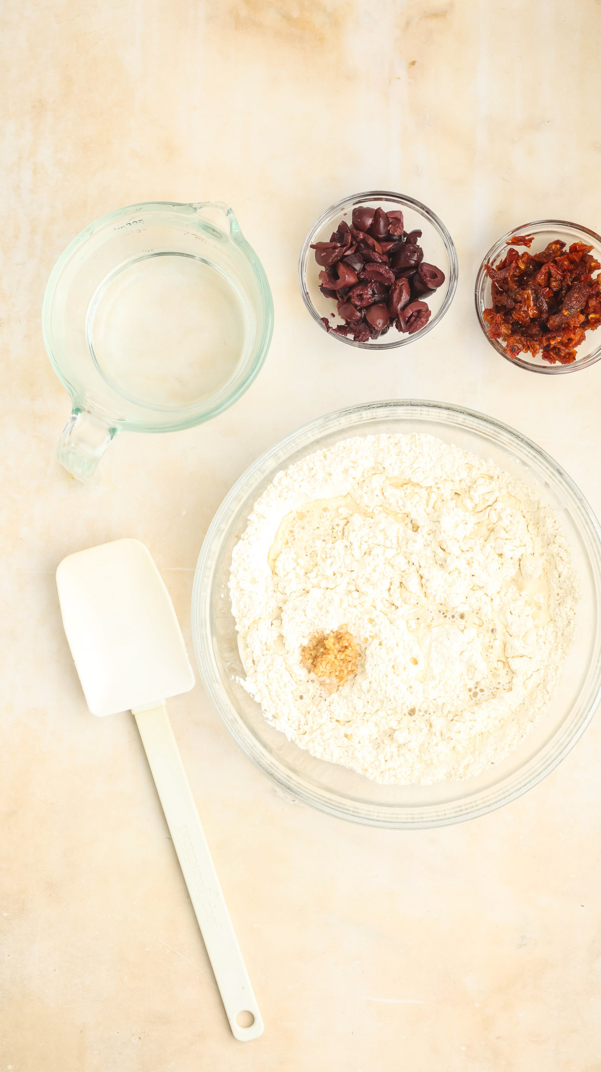 Image of wet ingredients and mix-ins being added.