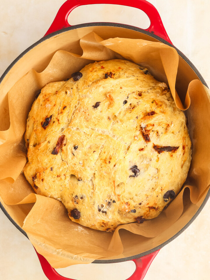 Artesian Italian Bread in a red enameled Dutch Oven.