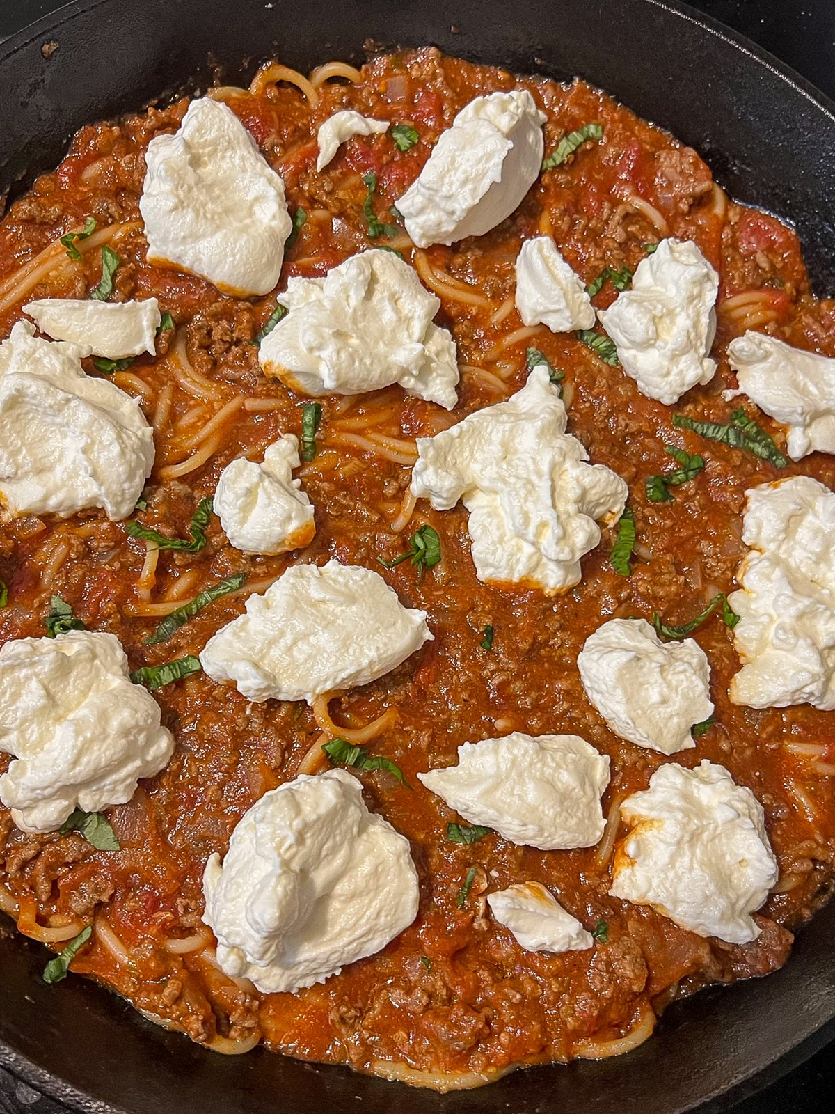Dollops of riccotta to create a cheesy layer of the pasta dish.