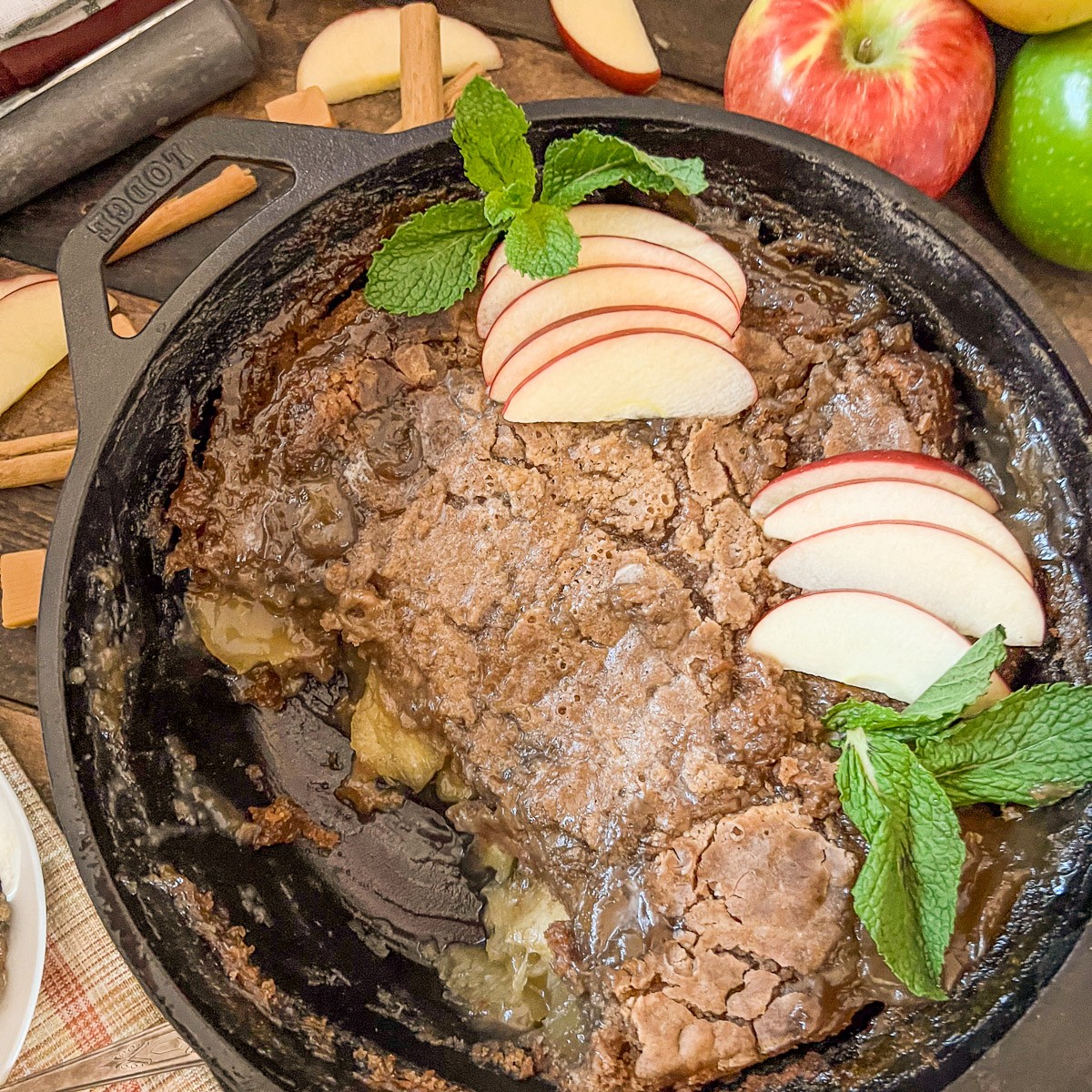 Caramel apple dump cake baked in a cast iron skillet.