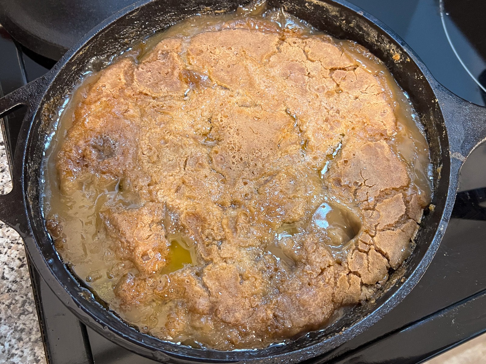 Fresh from the oven, caramel and apple filling bubble around the edges.