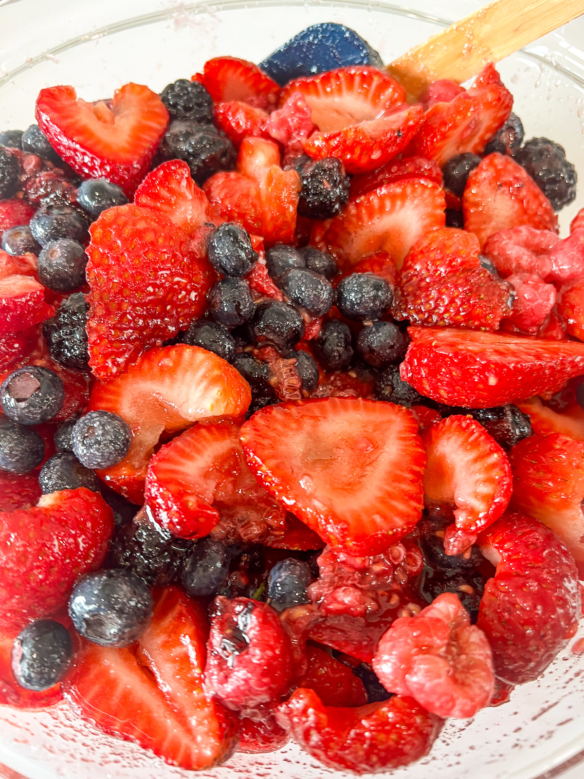 Pie crust cut into shapes on a floured surface for skillet berry cobbler