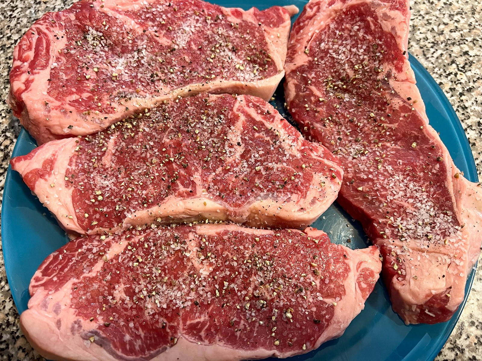Butter, granulated garlic, and fresh rosemary in a hot skillet.
