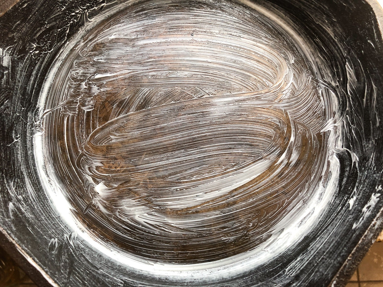 Cast iron skillet heavily coated in softened butter.