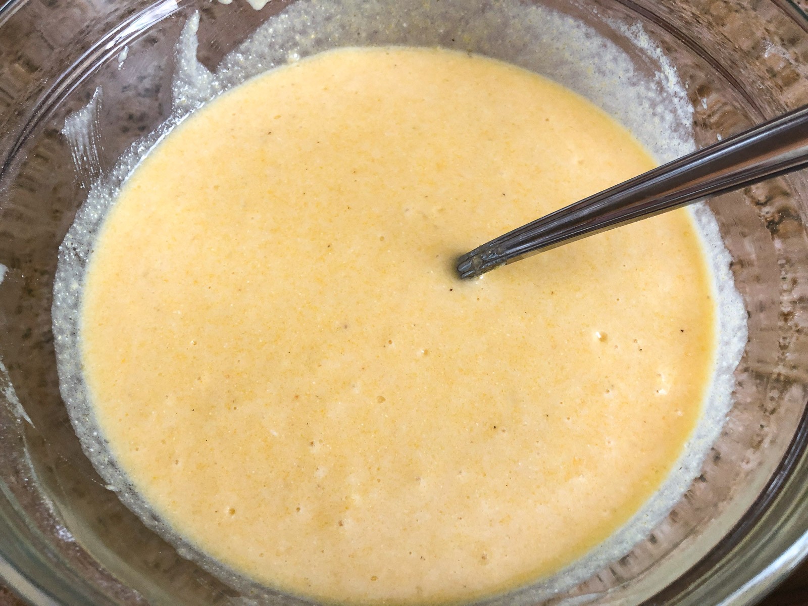 The wet ingredients have been stirred into the dry ingredients.