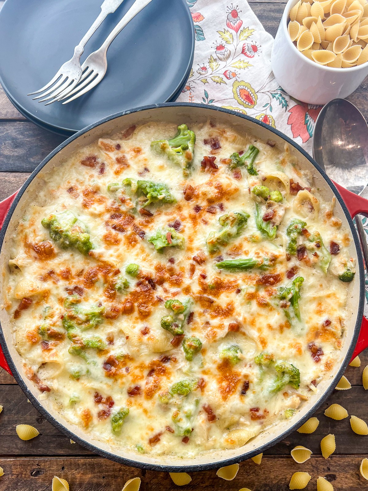 Freshly baked chicken broccoli casserole in a red enameled Dutch oven.