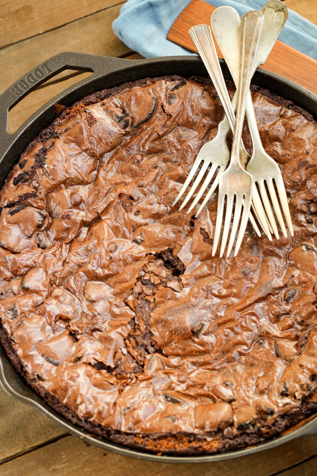 Milk chocolate brownie batter poured into the enameled skillet.