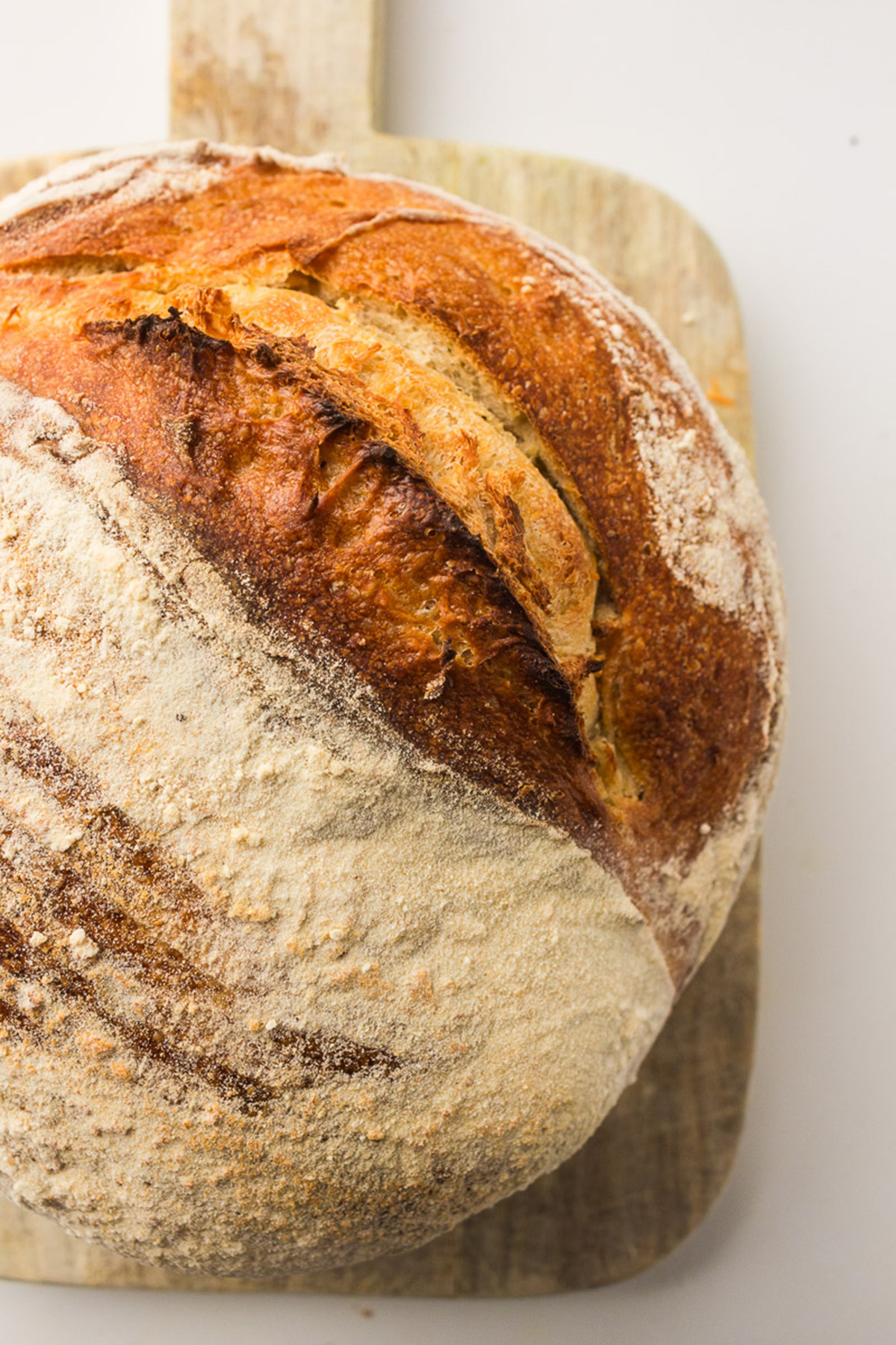 Sourdough Bread on a wooden cutting board.