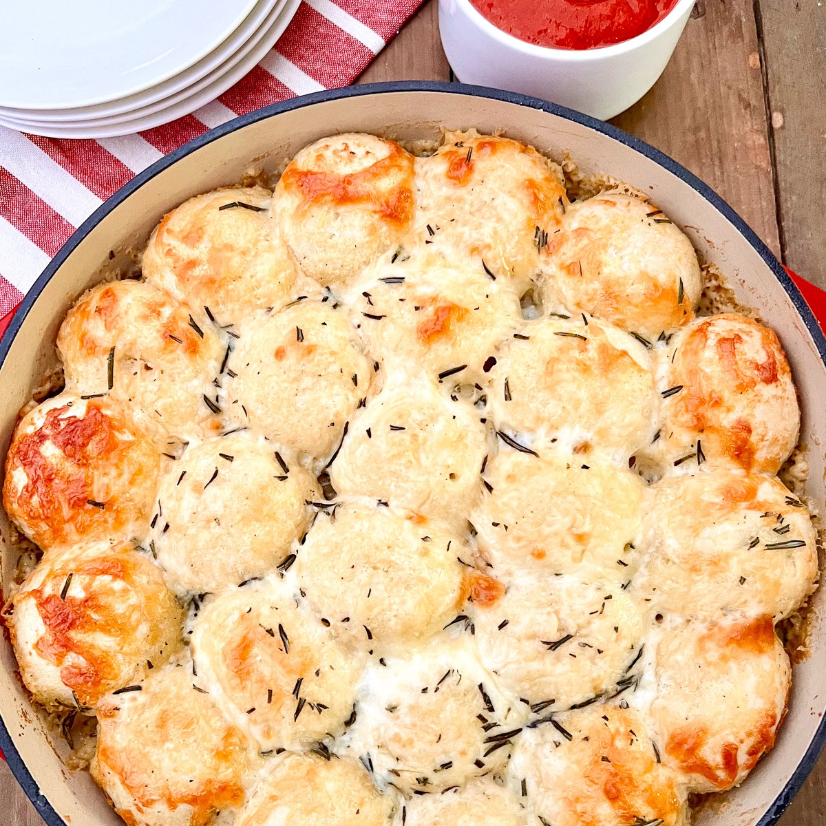 Cheesy pull apart bread baked golden in a cast iron skillet.